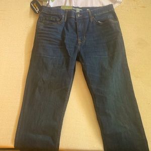 Dark blue jeans and the brand is goodfellow, slim it’s a great fit